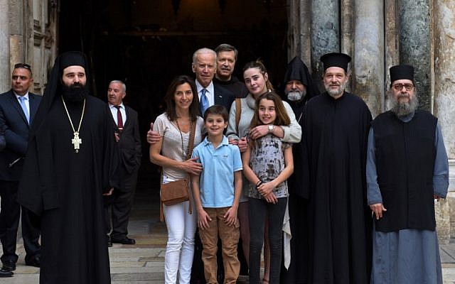 US Vice President Joe Biden poses with his family and priests outside the Church of the Holy Sepulchre in Jerusalem's Old City, March 9, 2016 .(AFP/Debbie Hill) US Vice President Joe Biden poses with his family and priests outside the Church of the Holy Sepulchre in Jerusalem's Old City, March 9, 2016 .(AFP/Debbie Hill)