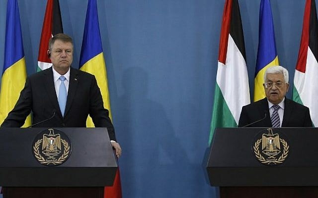 Palestinian Authority President Mahmoud Abbas (R) and Romanian President Klaus Iohannis during a joint press conference in the West Bank city of Ramallah on March 10, 2016. (AFP/Abbas MomaniI) Palestinian Authority President Mahmoud Abbas (R) and Romanian President Klaus Iohannis during a joint press conference in the West Bank city of Ramallah on March 10, 2016. (AFP/Abbas MomaniI)