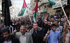 Palestinian supporters of the Islamic Jihad Movement take part in a demonstration following Friday prayers in Khan Yunis in the southern Gaza Strip on March 11, 2016. (AFP/SAID KHATIB)