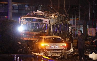 The wreckage of a bus and a car are pictured at the scene of a blast in Ankara on March 13, 2016. (AFP/Erol Ucem)