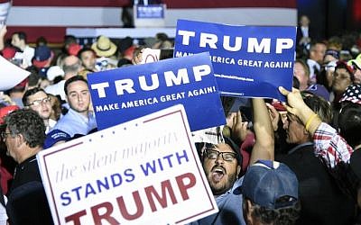 A protester is surrounded by Donald Trump supporters as he tries to disrupt a rally for the Republican presidential candidate in Boca Raton, Florida, March 13, 2016. (AFP/Rhona Wise) A protester is surrounded by Donald Trump supporters as he tries to disrupt a rally for the Republican presidential candidate in Boca Raton, Florida, March 13, 2016. (AFP/Rhona Wise)