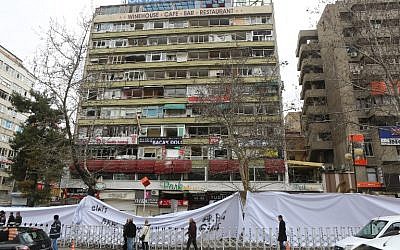 People walk in Ankara on March 15, 2016 past the site of a suicide car bombing on March 13 that left 35 dead. (AFP/Adem Altan) People walk in Ankara on March 15, 2016 past the site of a suicide car bombing on March 13 that left 35 dead. (AFP/Adem Altan)