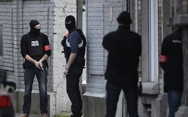 Police officers stand at the site of a shooting on Dries-Driesstraat at Forest-Vorst in Brussels, Belgium on March 15, 2016. (AFP / BELGA / DIRK WAEM) Police officers stand at the site of a shooting on Dries-Driesstraat at Forest-Vorst in Brussels, Belgium on March 15, 2016. (AFP / BELGA / DIRK WAEM)