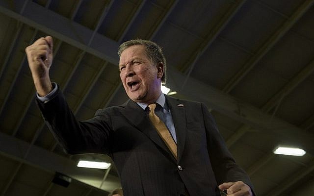 Republican US Presidential hopeful Ohio Governor John Kasich celebrates his Ohio primary victory during voting day rally at Baldwin Wallace University March 15, 2016 in Berea, Ohio. (AFP / Brendan Smialowski)