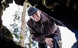 Jozef Jarosz looks on March 16, 2016 into an underground hideout in Stankowa, Poland, where he and his family helped Anna Grygiel and 13 other Jews to survive the Holocaust and WWII.  (AFP / WOJTEK RADWANSKI)