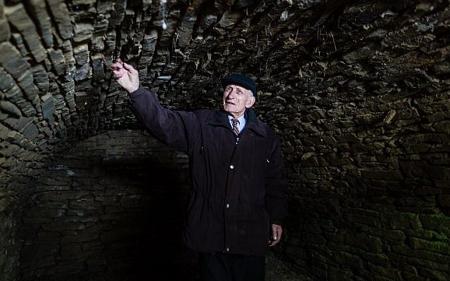 Jozef Jarosz stands on March 16, 2016 in an underground hideout in Stankowa, Poland, where he and his family helped Anna Grygiel and 13 other Jews to survive the Holocaust and WWII. (AFP / WOJTEK RADWANSKI) Jozef Jarosz stands on March 16, 2016 in an underground hideout in Stankowa, Poland, where he and his family helped Anna Grygiel and 13 other Jews to survive the Holocaust and WWII. (AFP / WOJTEK RADWANSKI)
