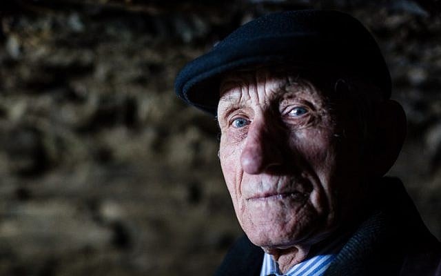 Jozef Jarosz stands on March 16, 2016 in an underground hideout in Stankowa, Poland, where he and his family helped Anna Grygiel and 13 other Jews to survive the Holocaust and WWII. (AFP / WOJTEK RADWANSKI)