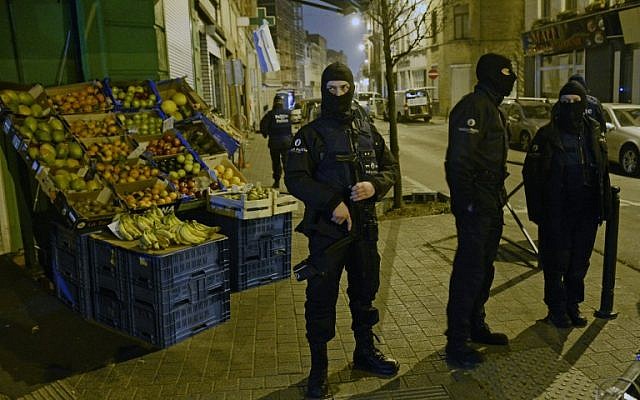 Police stand guard near a scene of a police operation in the Molenbeek-Saint-Jean district in Brussels, on March 18, 2016, as part of the investigation into the Paris November attacks. (AFP/BELGA/Dirk Waem) Police stand guard near a scene of a police operation in the Molenbeek-Saint-Jean district in Brussels, on March 18, 2016, as part of the investigation into the Paris November attacks. (AFP/BELGA/Dirk Waem)