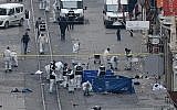 Turkish police, forensics and emergency services work at the scene of an explosion on the pedestrian Istiklal Street in Istanbul on March 19, 2016.
(AFP/ILHAS NEWS AGENCY)