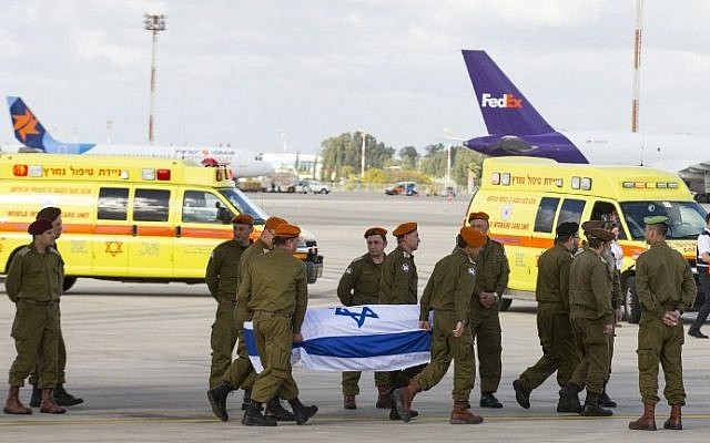 IDF soldiers carry the coffin of one of three Israelis killed a day earlier in an Istanbul suicide bombing, as the bodies of the victims arrive at Ben Gurion Airport on March 20, 2016. (AFP/Jack Guez) IDF soldiers carry the coffin of one of three Israelis killed a day earlier in an Istanbul suicide bombing, as the bodies of the victims arrive at Ben Gurion Airport on March 20, 2016. (AFP/Jack Guez)