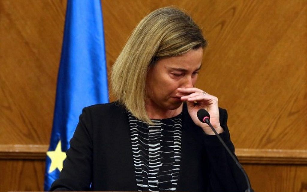 EU foreign policy chief Federica Mogherini reacts during a joint press conference with Jordanian Foreign Minister in the capital Amman, on March 22, 2016, upon receiving the news about a string of explosions that rocked Brussels airport and a city metro station. (AFP / str)