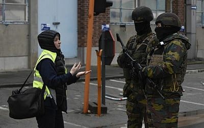 Belgian soldiers stand guard near Brussels airport in Zaventem on March 23, 2016 a day after terror attacks hit the city. (AFP / JOHN THYS)