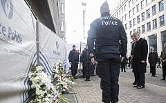 King Philippe Belgium and Queen Mathilde of Belgium mourn after laying down flowers in the area of the explosion at the Maalbeek subway station in Brussels, on March 23, 2016. (AFP/BELGA/THIERRY ROGE)