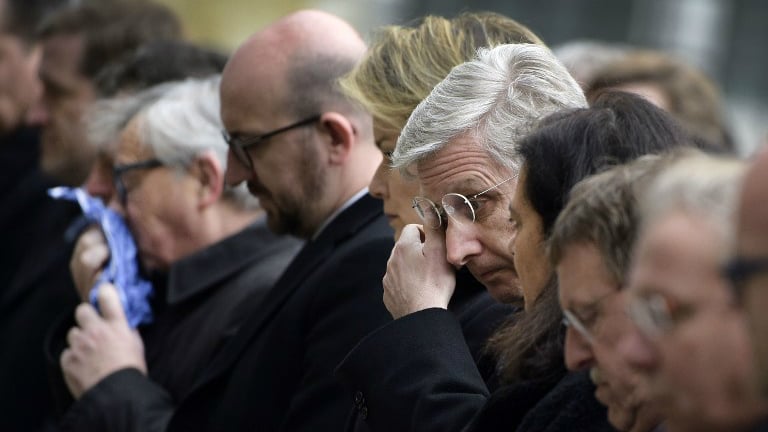 (From L) European Commission President Jean-Claude Juncker, Belgian Prime Minister Charles Michel and King Philippe of Belgium react before observing a minute of silence on March 24, 2016 at the Federal Parliament in Brussels, during a homage ceremony for victims two days after a triple bomb attack claimed by the Islamic State group hit Brussels's airport and the Maalbeek metro station, killing 31 people and wounding 270 others. (Yorick Jansens/Belga/AFP) (From L) European Commission President Jean-Claude Juncker, Belgian Prime Minister Charles Michel and King Philippe of Belgium react before observing a minute of silence on March 24, 2016 at the Federal Parliament in Brussels, during a homage ceremony for victims two days after a triple bomb attack claimed by the Islamic State group hit Brussels's airport and the Maalbeek metro station, killing 31 people and wounding 270 others. (Yorick Jansens/Belga/AFP)