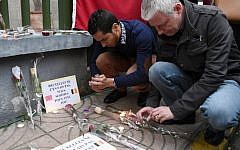 A man lights a candle at a makeshift memorial in tribute to the victims of the Brussels attacks, in Casablanca on March 26, 2016. (Fadel Senna/AFP)