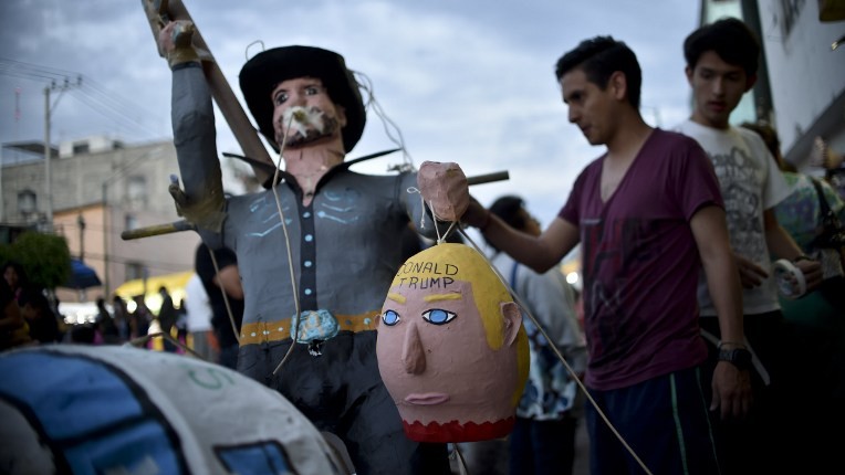Mexican's prepare to set fire to an effigy depicting US Republican presidential candidate Donald Trump during Holy Week celebrations in Mexico City on March 26, 2016. (Yuri Cortez/AFP) Mexican's prepare to set fire to an effigy depicting US Republican presidential candidate Donald Trump during Holy Week celebrations in Mexico City on March 26, 2016. (Yuri Cortez/AFP)