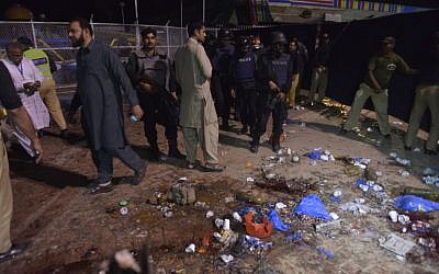 Pakistani rescuers and officials gather at a the site of a bombing at a crowded park in Lahore on March 27, 2016. where many minority Christians had gone to celebrate Easter Sunday. (AFP/ARIF ALI) Pakistani rescuers and officials gather at a the site of a bombing at a crowded park in Lahore on March 27, 2016. where many minority Christians had gone to celebrate Easter Sunday. (AFP/ARIF ALI)