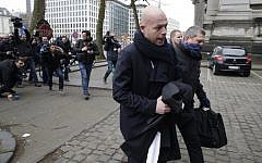 Sven Mary (C), lawyer of key suspect in the Paris terror attacks Salah Abdeslam, arrives to the Council Chamber of Brussels on March 24, 2016 during investigations into the Paris and Brussels terror attacks. (AFP/KENZO TRIBOUILLARD)