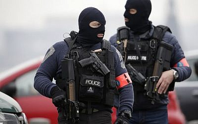 Special police forces stand guard outside the Council Chamber of Brussels on March 24, 2016, during investigations into the Paris and Brussels terror attacks. (AFP/Kenzo Tribouillard) Special police forces stand guard outside the Council Chamber of Brussels on March 24, 2016, during investigations into the Paris and Brussels terror attacks. (AFP/Kenzo Tribouillard)