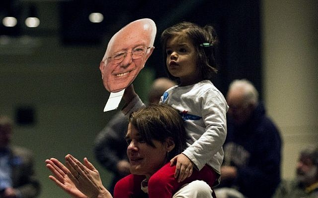 Emma Belalcazar holds a sign as she sits on her mother, Alison Campbell's, shoulders at a campaign rally for Democratic presidential candidate Sen. Bernie Sanders (D-VT) at the Minneapolis Convention Center February 29, 2016 in Minneapolis, Minnesota. (Stephen Maturen/Getty Images/AFP) Emma Belalcazar holds a sign as she sits on her mother, Alison Campbell's, shoulders at a campaign rally for Democratic presidential candidate Sen. Bernie Sanders (D-VT) at the Minneapolis Convention Center February 29, 2016 in Minneapolis, Minnesota. (Stephen Maturen/Getty Images/AFP)