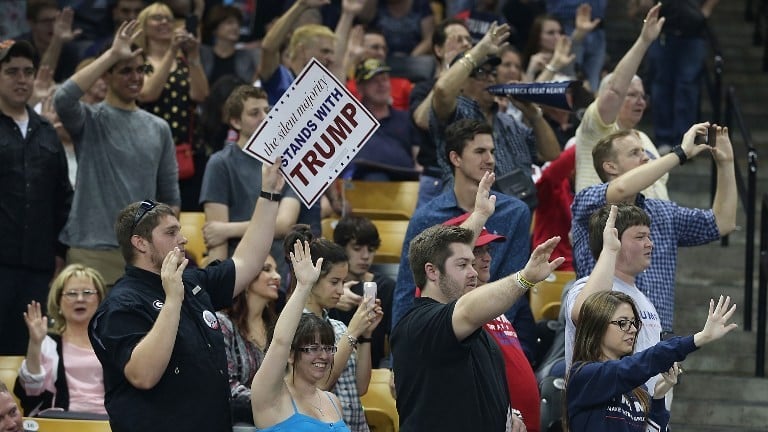 People raise their arms as Republican presidential candidate Donald Trump ask them to pledge that they will vote for him during a campaign rally at the CFE Arena on the campus of the University of Central Florida on March 5, 2016 in Orlando, Florida. ( Joe Raedle/Getty Images/AFP) People raise their arms as Republican presidential candidate Donald Trump ask them to pledge that they will vote for him during a campaign rally at the CFE Arena on the campus of the University of Central Florida on March 5, 2016 in Orlando, Florida. ( Joe Raedle/Getty Images/AFP)