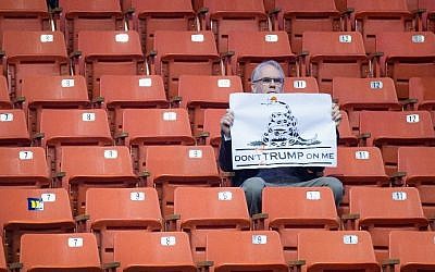 A demonstrator waits for the start of a rally with Republican presidential candidate Donald Trump at the University of Illinois at Chicago on March 11, 2016 in Chicago, Illinois. The campaign decided to postpone the rally, citing safety concerns, after learning hundreds of demonstrators were given tickets for the event. (Scott Olson/Getty Images/AFP)