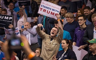 A supporter of Republican presidential candidate Donald Trump heckles demonstrators before the start of a rally at the University of Illinois at Chicago on March 11, 2016 in Chicago, Illinois. (Scott Olson/Getty Images/AFP)