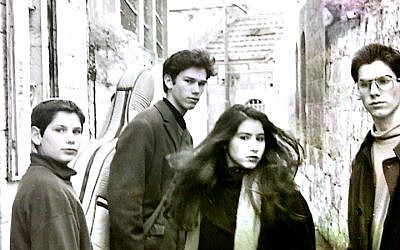 Ricka Razel (second from right) and her brothers outside their childhood home in the Nahlaot neighborhood of Jerusalem  (Courtesy Ricka Razel Van-Leeuwen)