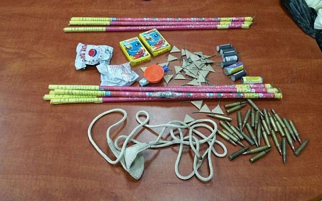 Ammunition, firecrackers, and a sling shot discovered by police in the Od Yosef Hai yeshiva in the West Bank settlement of Yitzhar, March 15, 2016. (Israel Police) Ammunition, firecrackers, and a sling shot discovered by police in the Od Yosef Hai yeshiva in the West Bank settlement of Yitzhar, March 15, 2016. (Israel Police)