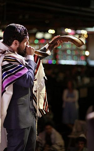 Rabbi Dan Ain, blowing a shofar, is knocking down conventional Judaism's walls and making the profane sacred. (Belathee Photography)