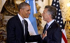 US President Barack Obama shakes hands with Argentina's President Mauricio Macri at the government house in Buenos Aires, Argentina, Wednesday, March 23, 2016. Obama is on a two day official visit to Argentina. (Martin Zabala/Pool Photo via AP)