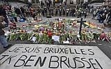 A banner for the victims of the bombings reads 'I am Brussels' at the Place de la Bourse in the center of Brussels, Wednesday, March 23, 2016 (AP Photo/Martin Meissner)