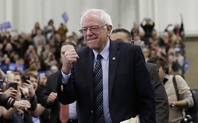 Democratic presidential candidate, Sen. Bernie Sanders, I-Vt, pumps his fist as he arrives for at a rally at the Macomb Community College, Saturday, March 5, 2016, in Warren, Mich. (AP Photo/Carlos Osorio) Democratic presidential candidate, Sen. Bernie Sanders, I-Vt, pumps his fist as he arrives for at a rally at the Macomb Community College, Saturday, March 5, 2016, in Warren, Mich. (AP Photo/Carlos Osorio)