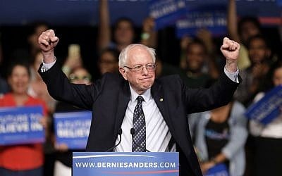 Democratic presidential candidate, Sen. Bernie Sanders, I-Vt. acknowledges his supporters on arrival at a campaign rally, Tuesday, March 8, 2016, in Miami. (AP Photo/Alan Diaz) 