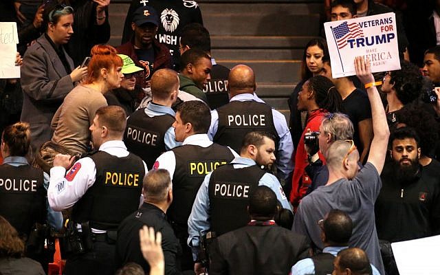 A demonstrator is removed by Chicago police during a rally for Republican presidential candidate Donald Trump at the University of Illinois at Chicago Pavilion in Chicago on Friday, March 11, 2016. (Chris Sweda/Chicago Tribune via AP) A demonstrator is removed by Chicago police during a rally for Republican presidential candidate Donald Trump at the University of Illinois at Chicago Pavilion in Chicago on Friday, March 11, 2016. (Chris Sweda/Chicago Tribune via AP)
