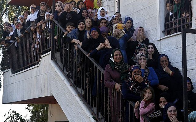 Palestinian women mourn during the funeral of Raed Jaradat, 22, in the West Bank village of Sa'ir, near Hebron, Sunday, Nov 1, 2015. According to the Israeli army, Jaradat stabbed an Israeli before being shot and killed. (AP Photo/Nasser Shiyoukhi)