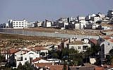 The town of Anata, with the Jerusalem neighborhood of Pisgat Zeev in the foreground. ( Mohamar Awad/Flash 90)