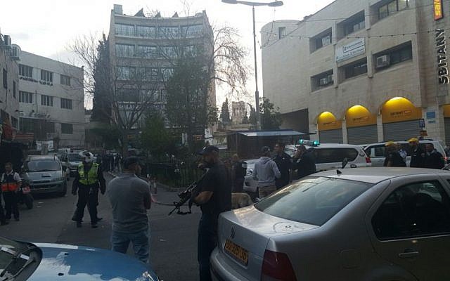 Police take up positions at the scene of a shooting attack on Salah a-Din street in Jerusalem on March 8, 2016. (United Hatzalah)