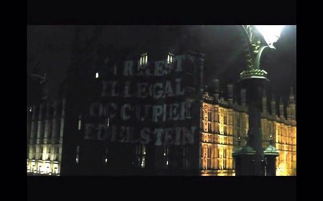 "Arrest illegal occupation Edelstein," projected onto the walls of the Palace of Westminster, March 2, 2016. (Screenshot from YouTube)
