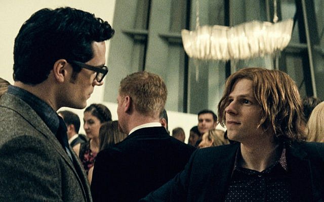 Henry Cavill, left, as Clark Kent, and Jesse Eisenberg as Lex Luthor in “Batman v. Superman: Dawn of Justice.” (Courtesy of Warner Bros. Pictures/DC Comics)