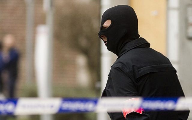 Police secure an area after an apartment raid in Brussels, March 15, 2016. (AP Photo/Thierry Monasse) Police secure an area after an apartment raid in Brussels, March 15, 2016. (AP Photo/Thierry Monasse)