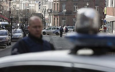 Police secure the Forest neighborhood in Brussels after an apartment raid during a major anti-terror operation, March 15, 2016. (AP Photo/Thierry Monasse) Police secure the Forest neighborhood in Brussels after an apartment raid during a major anti-terror operation, March 15, 2016. (AP Photo/Thierry Monasse)