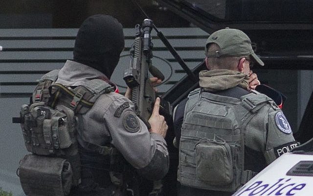 Police secure the Forest neighborhood in Brussels after an apartment raid during a major anti-terror operation, March 15, 2016. (AP Photo/Thierry Monasse) Police secure the Forest neighborhood in Brussels after an apartment raid during a major anti-terror operation, March 15, 2016. (AP Photo/Thierry Monasse)