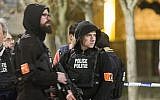 Police secure an area during a police raid in the Molenbeek neighbourhood of Brussels, Belgium on Friday, March 18, 2016. (AP/Geoffrey Van der Hasselt)