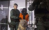 Illustrative photo of a Spanish Civil Guard policeman detaining a suspect in Madrid, Spain. February 17, 2016 (AP Photo/Francisco Seco, File)