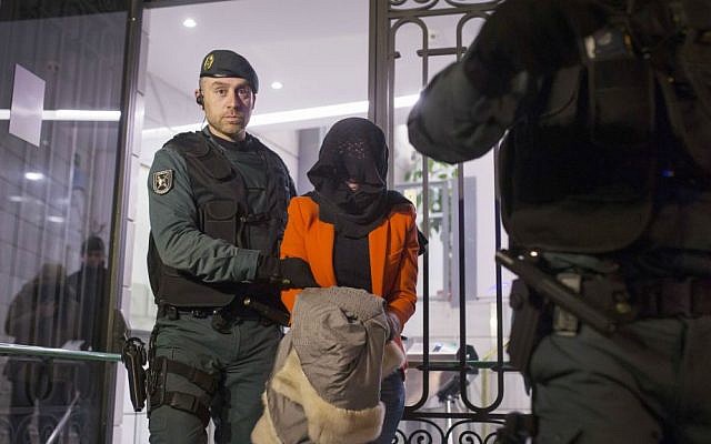 Illustrative photo of a Spanish Civil Guard policeman detaining a suspect in Madrid, Spain. February 17, 2016 (AP Photo/Francisco Seco, File) Illustrative photo of a Spanish Civil Guard policeman detaining a suspect in Madrid, Spain. February 17, 2016 (AP Photo/Francisco Seco, File)