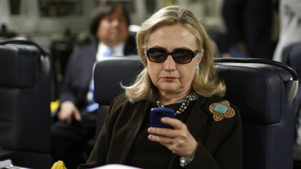In this Oct. 18, 2011, file photo, then-secretary of state Hillary Clinton checks her Blackberry from a desk inside a C-17 military plane upon her departure from Malta, in the Mediterranean Sea, bound for Tripoli, Libya. (AP Photo/Kevin Lamarque, Pool, File) In this Oct. 18, 2011, file photo, then-secretary of state Hillary Clinton checks her Blackberry from a desk inside a C-17 military plane upon her departure from Malta, in the Mediterranean Sea, bound for Tripoli, Libya. (AP Photo/Kevin Lamarque, Pool, File)
