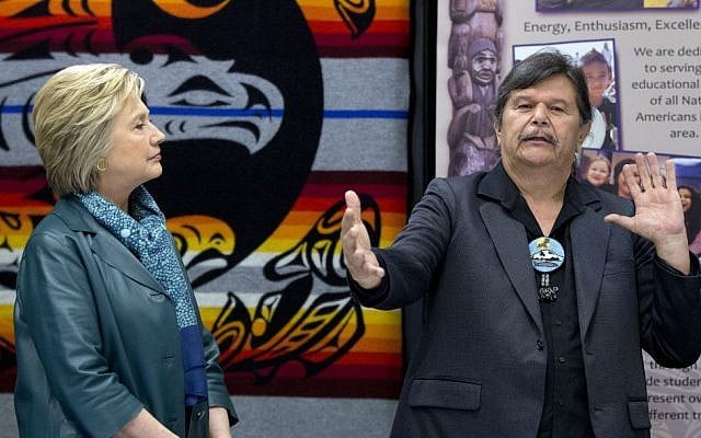 Democratic presidential candidate Hillary Clinton looks to Puyallup tribal member Bill Sterud, as he speaks during a roundtable with Washington Tribal Leaders at Chief Leschi School in Puyallup, Washington, Tuesday, March 22, 2016. (AP/Carolyn Kaster)