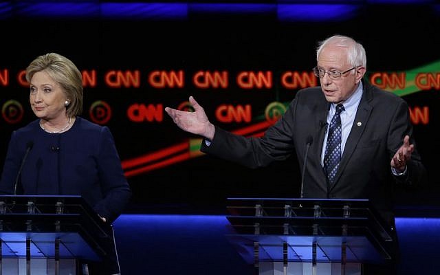 Democratic presidential candidate, Sen. Bernie Sanders, I-Vt., argues a point as Hillary Clinton looks on during a Democratic presidential primary debate at the University of Michigan-Flint, Sunday, March 6, 2016, in Flint, Mich. (AP Photo/Carlos Osorio) Democratic presidential candidate, Sen. Bernie Sanders, I-Vt., argues a point as Hillary Clinton looks on during a Democratic presidential primary debate at the University of Michigan-Flint, Sunday, March 6, 2016, in Flint, Mich. (AP Photo/Carlos Osorio)