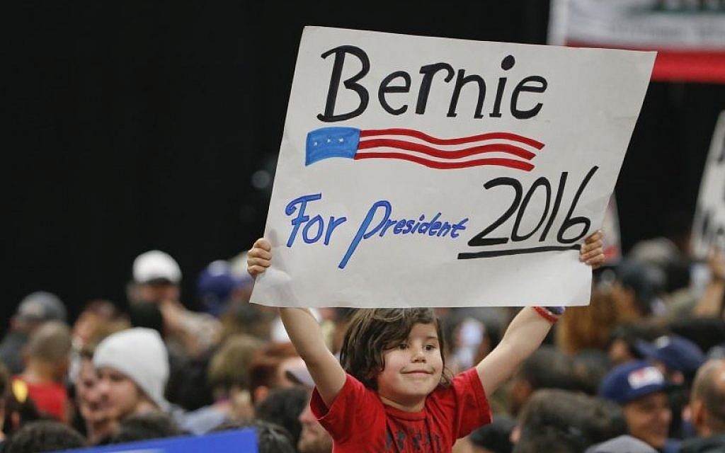 A child holds a sign supporting Democratic presidential candidate Sen. Bernie Sanders while awaiting his arrival at the San Diego Convention Center Tuesday, March 22, 2016. (AP/Lenny Ignelzi) A child holds a sign supporting Democratic presidential candidate Sen. Bernie Sanders while awaiting his arrival at the San Diego Convention Center Tuesday, March 22, 2016. (AP/Lenny Ignelzi)